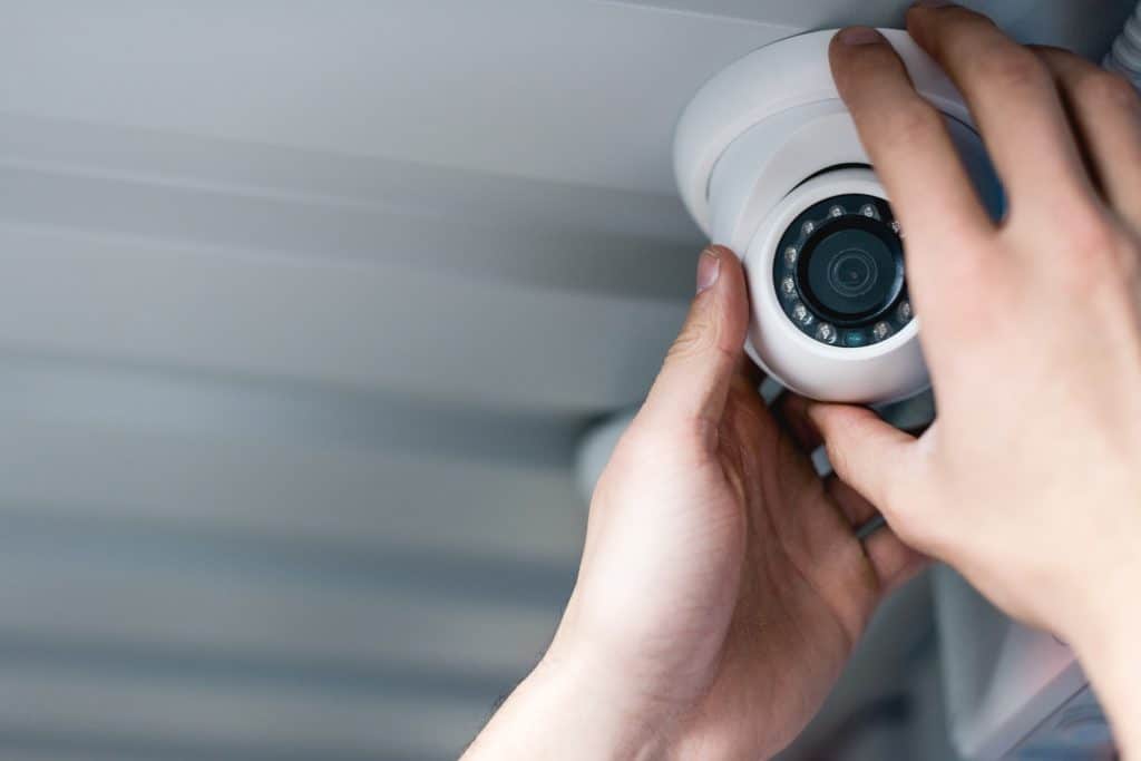 A man Installing security systems in Surrey
